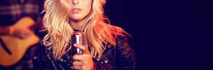 Portrait of female singer with blond hair - Powered by Adobe