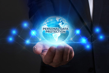 Business, Technology, Internet and network concept. Young businessman working on a virtual screen of the future and sees the inscription: Personal data protection