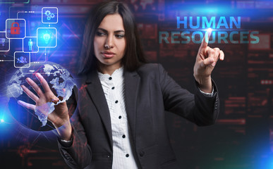 The concept of business, technology, the Internet and the network. A young entrepreneur working on a virtual screen of the future and sees the inscription: Human resources