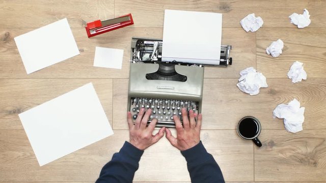 Book author's frustration, angry writer on a vintage typewriter. 4k video black and white and colors