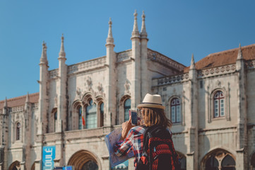 Fototapeta na wymiar Woman hands using mobile phone with blank display on historic building museum background. Communication technology recreational freedom activity. Closeup alone back view photo bright day outdoors