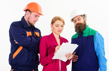 Builders and engineer work together. Female supervisor concept.