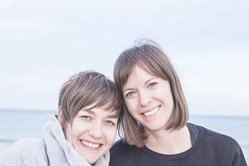 Two normal girls smiling