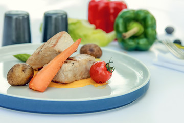 Grilled tuna steak with steamed vegetables