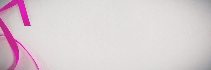 Pink ribbon on white background