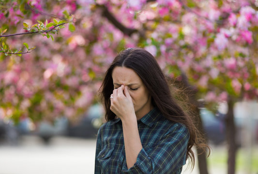 Woman having symptoms of spring pollen allergy