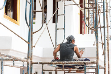 Worker repair building wall