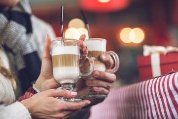 Couple having a glass of coffee at Christmas