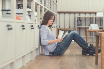 Attractive woman reading a book