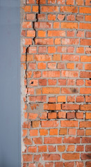 Fototapeta premium A crack in an old brick wall. Background