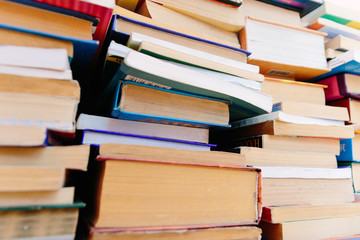 Stack of books background. many books piles.