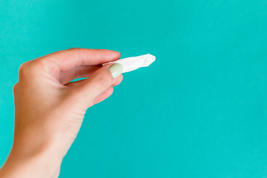 suppository rectal and vaginal in close-up on a blue background. concept treatment of hemorrhoids. treatment of gynecology