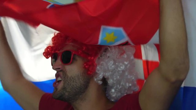 Croatian fan celebrating with flag