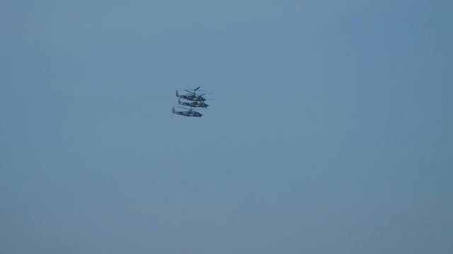 Military Russian helicopters in the sky. Machine to hit armored and unarmored vehicles, manpower and air targets on the battlefield.  