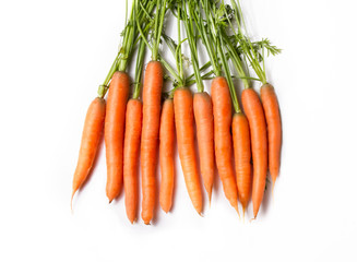 top view of fresh bundle of carrots with stem on white background 
