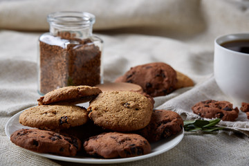 Open jar of instant coffee arranged on woden table, top view, close-up, selective focus.