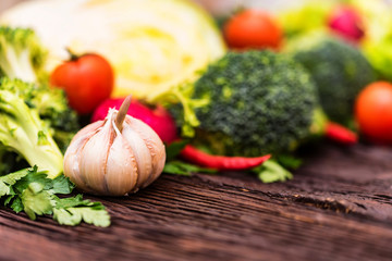 Fresh seasonal vegetables on wooden surface