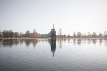 Fototapeta na wymiar Diana fountain, early morning autumn scene at bushy park in London