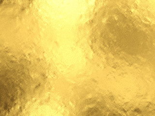 Gold foil background with light reflections