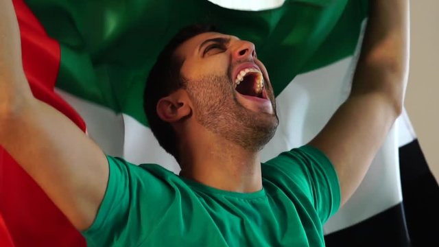 United Arab Emirates Fan Celebrating with Flag