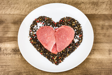 Raw meat in the shape of a heart.