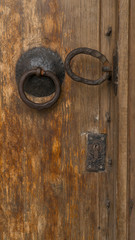 old wooden door with rusty locks