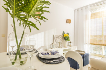 Living room with a dining table in modern, luxury, bright apartment