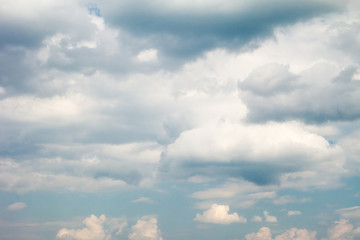 Blue sky with light cumulus clouds.