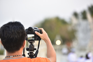 Fototapeta premium hand adjusting camera.