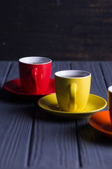 colored cups with coffee