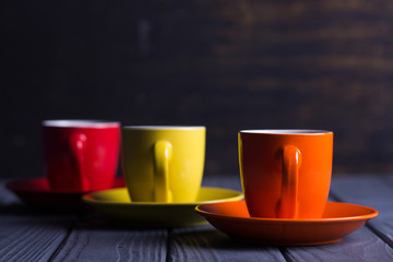 colored cups with coffee