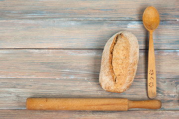 Fototapeta na wymiar Many mixed breads and rolls of baked bread on wooden table background. Top view