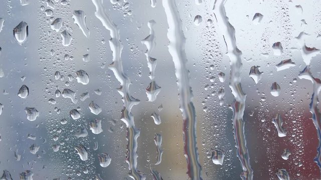 Rain drops pouring on the window