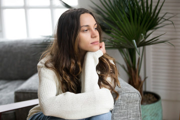 Pensive thoughtful young girl feeling lonely looking away lost in thoughts, sad depressed teenager...