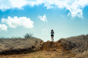 Female running cross country. 