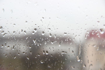 Background, texture – drops of rain water on the misted glass window cloudy autumn