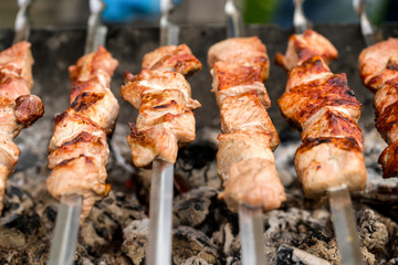 Barbecue on open air. Preparation of meat on the grill.