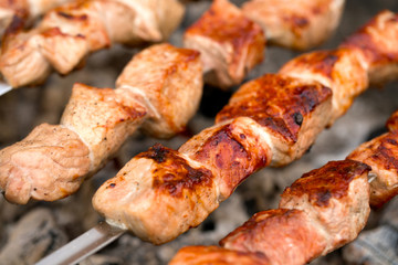 Barbecue on open air. Preparation of meat on the grill.