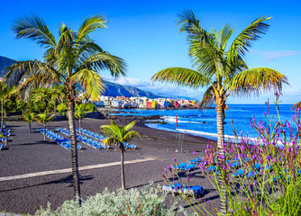 Puerto de la Cruz, Tenerife, Canary Islands, Spain: Famous beach Playa Jardin with black sand in a...