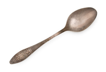 Vintage silverware, old decorated spoon isolated on a white, top view, close up.