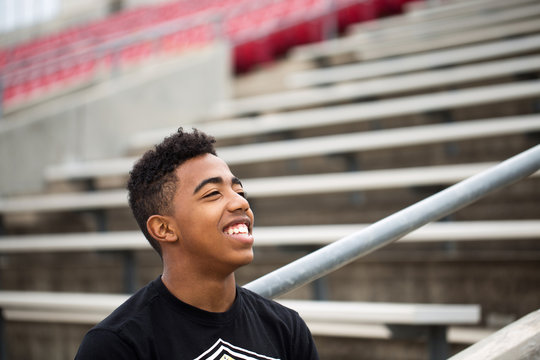 African American teenage boy smiling.
