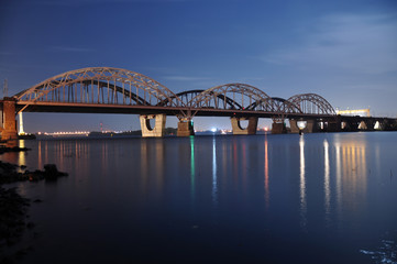 Fototapeta na wymiar Bridge over river. Night landscape.