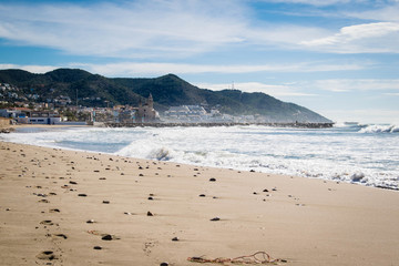 Fototapeta na wymiar The beautiful town of Sitges, Landscape of the coastline in Sitges, high tide