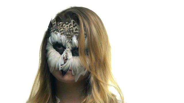 Close-up, Beautiful Girl with Owl's Grim on the Face Posing in Studio for Photographer