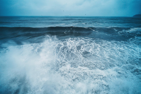 Aerial View Of Sea Waves And Dramatic Clouds