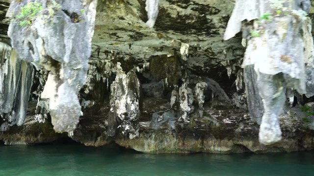 stalactites at the foot of islands in the ocean.