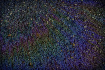 Multi colored Oil spill on asphalt road, abstract background or texture foe web site or mobile devices