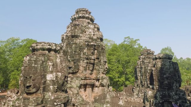Image of Buddha recognisable in ruins of Angkor Wat temple