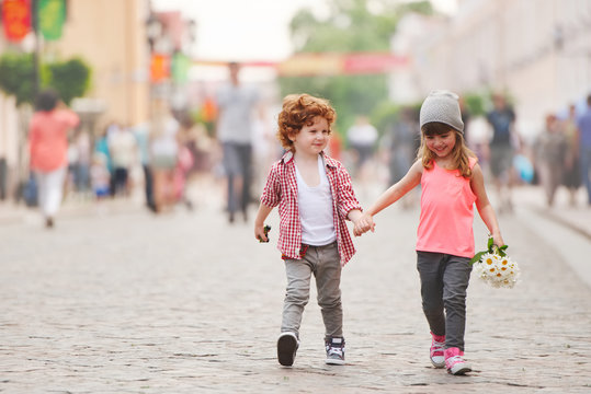 Boy And Girl Walking On The Street