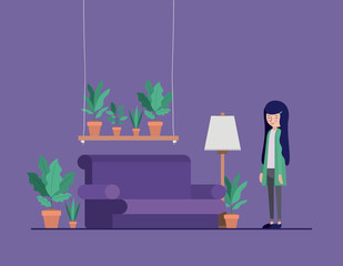 woman in the living room with houseplants and lamp